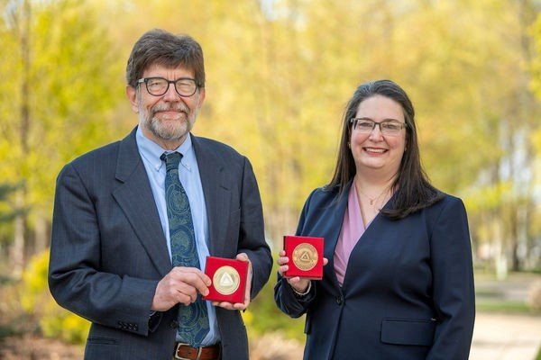 Catholic University in Ružomberok confers 20th Anniversary Medals on McAdams and Caro